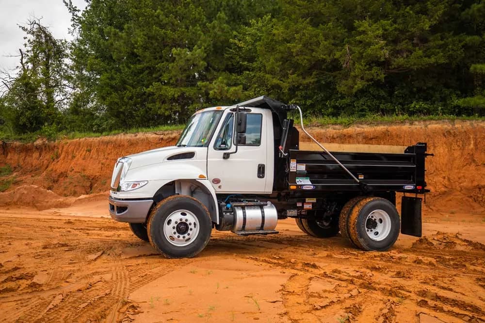 Ledwell box dump body on an International chassis, front three-quarter view