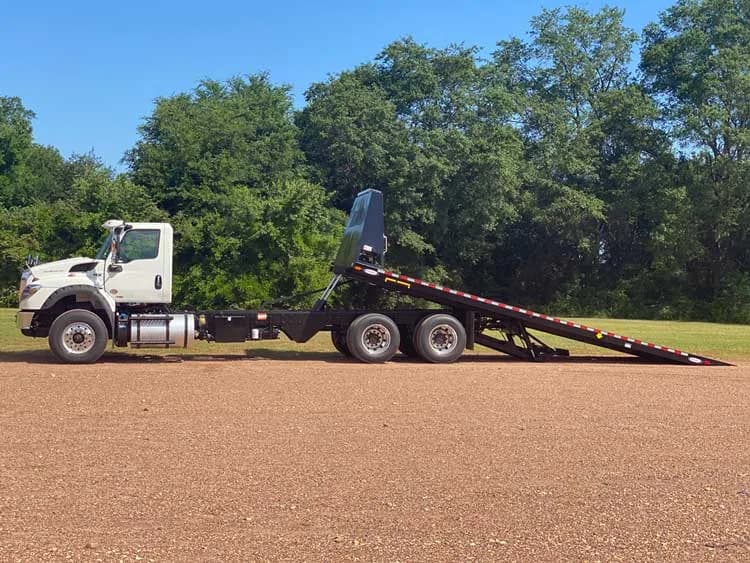 Ledwell hybrid rollback on an International chassis with the deck tilted and lowered