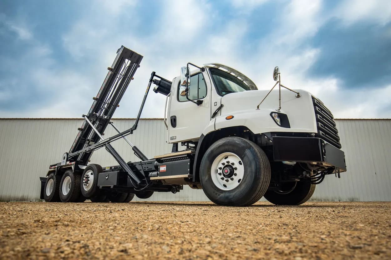 Ledwell roll-off hoist with a tarp system on a Freightliner chassis
