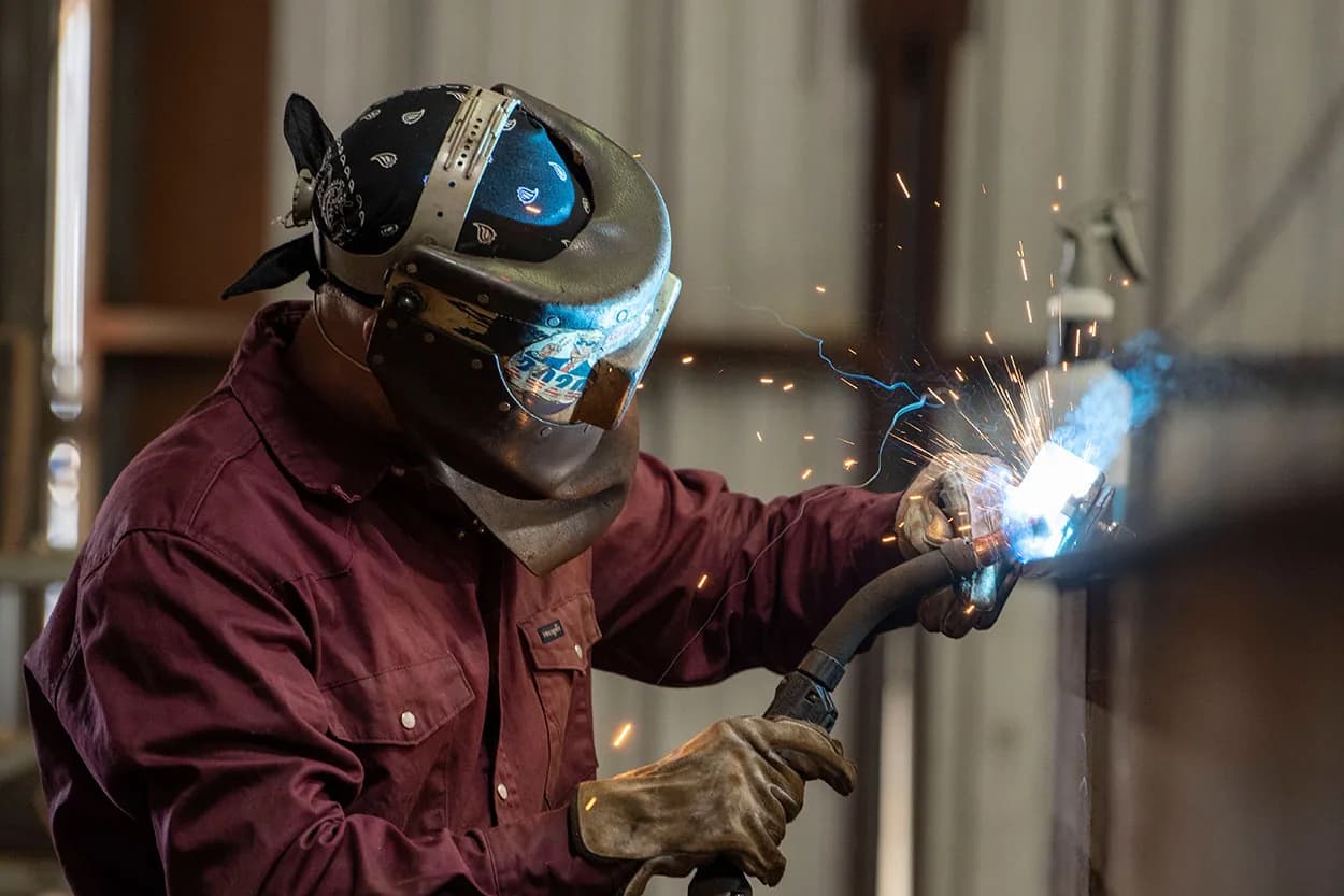 Welder fabricating steel in the Ledwell shop
