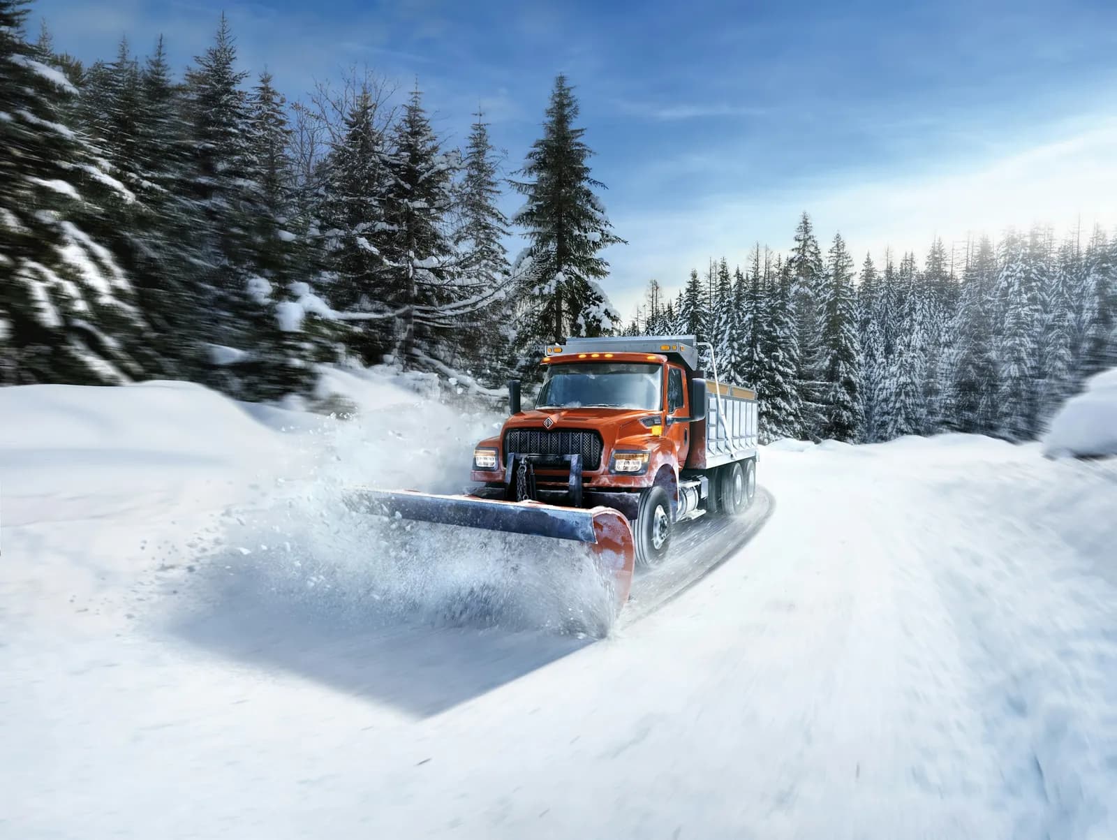 International HV Series truck plowing snow with heated LED headlamps