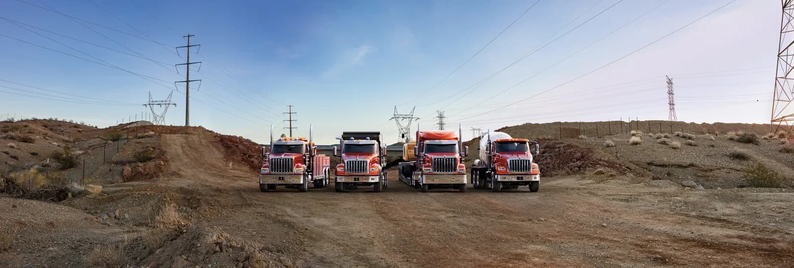 International HX Series cab family lineup on a dirt road