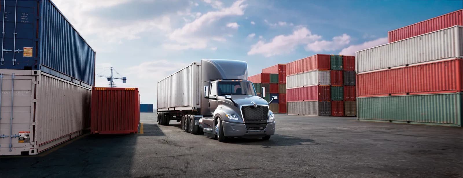 International LT Series intermodal tractor with shipping containers at a port