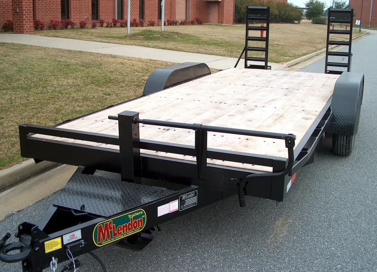 Black McLendon equipment trailer with stand-up ramps