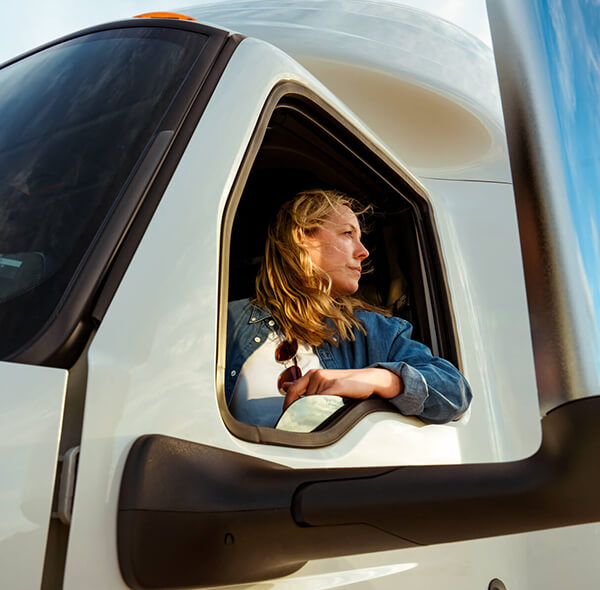 Driver in International truck cab