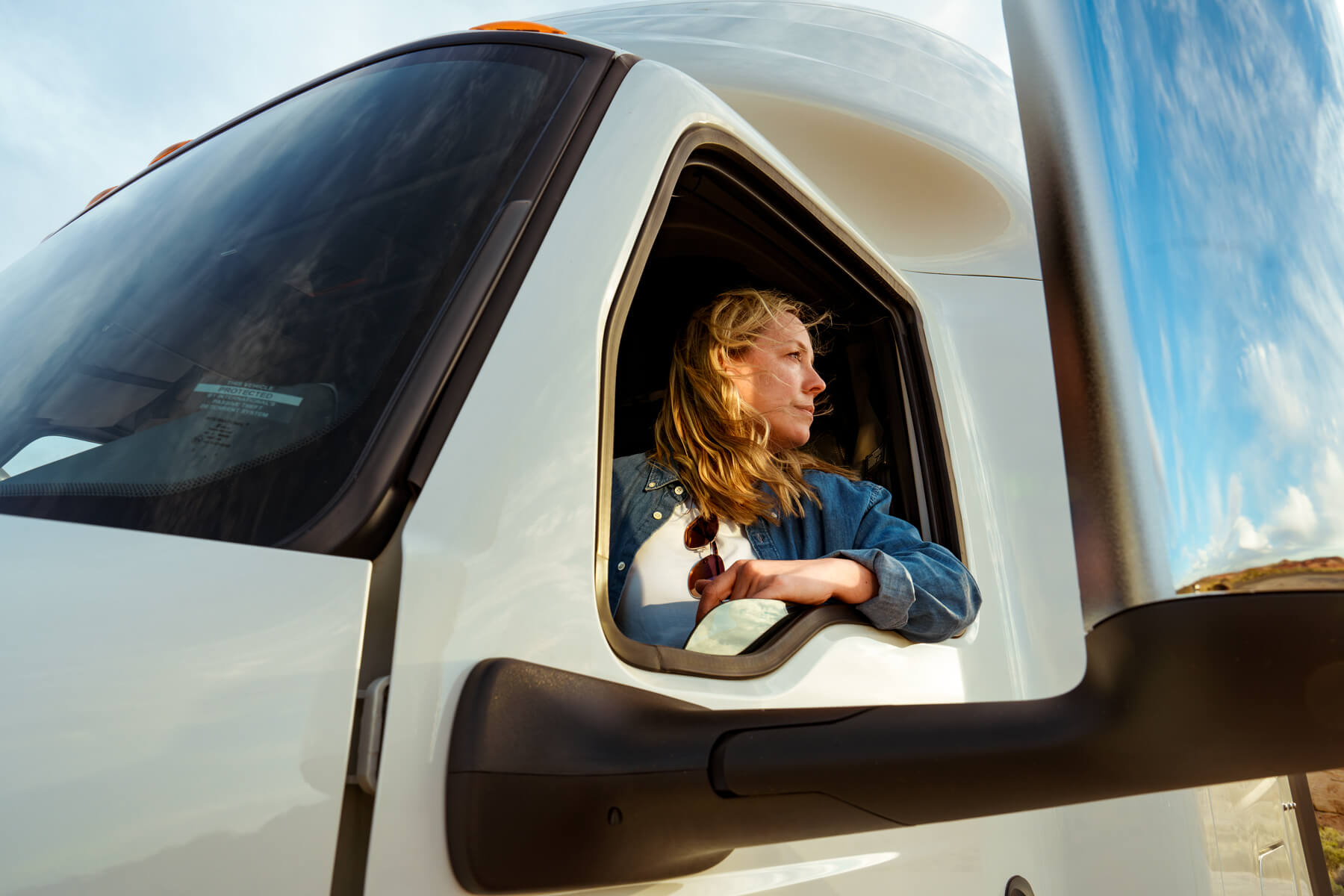 Driver in International truck cab